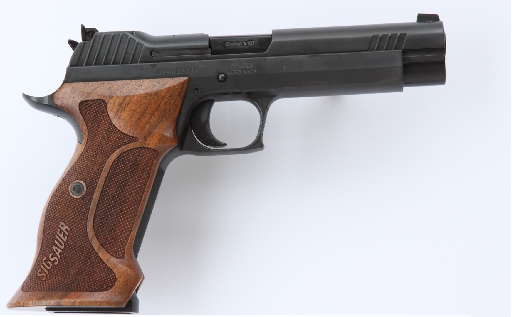 American-made SIG Sauer P210 Target 9mm pistol with walnut grips and extended beavertail