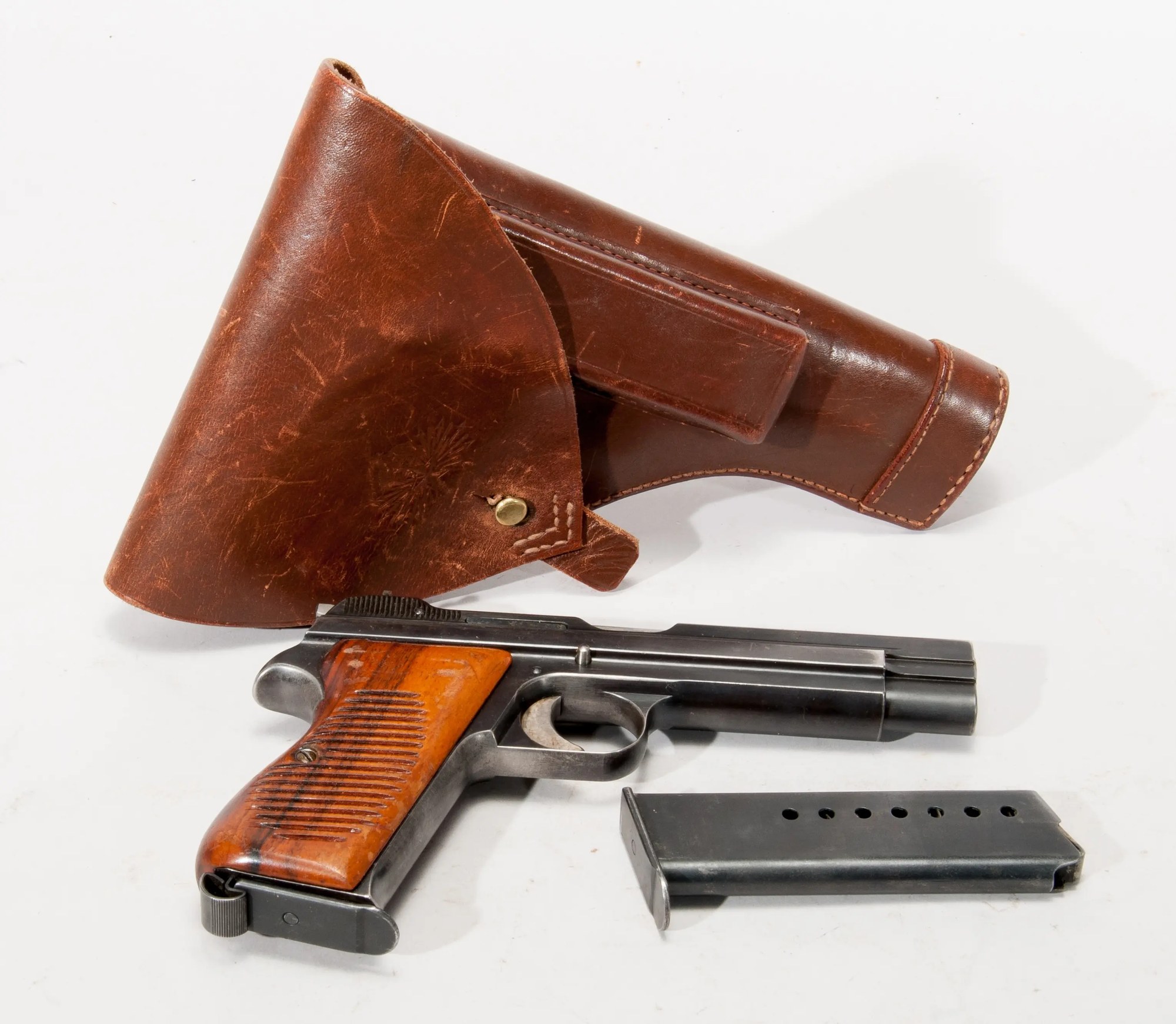 SIG SP47/8 pistol with brown leather flap holster and spare magazine