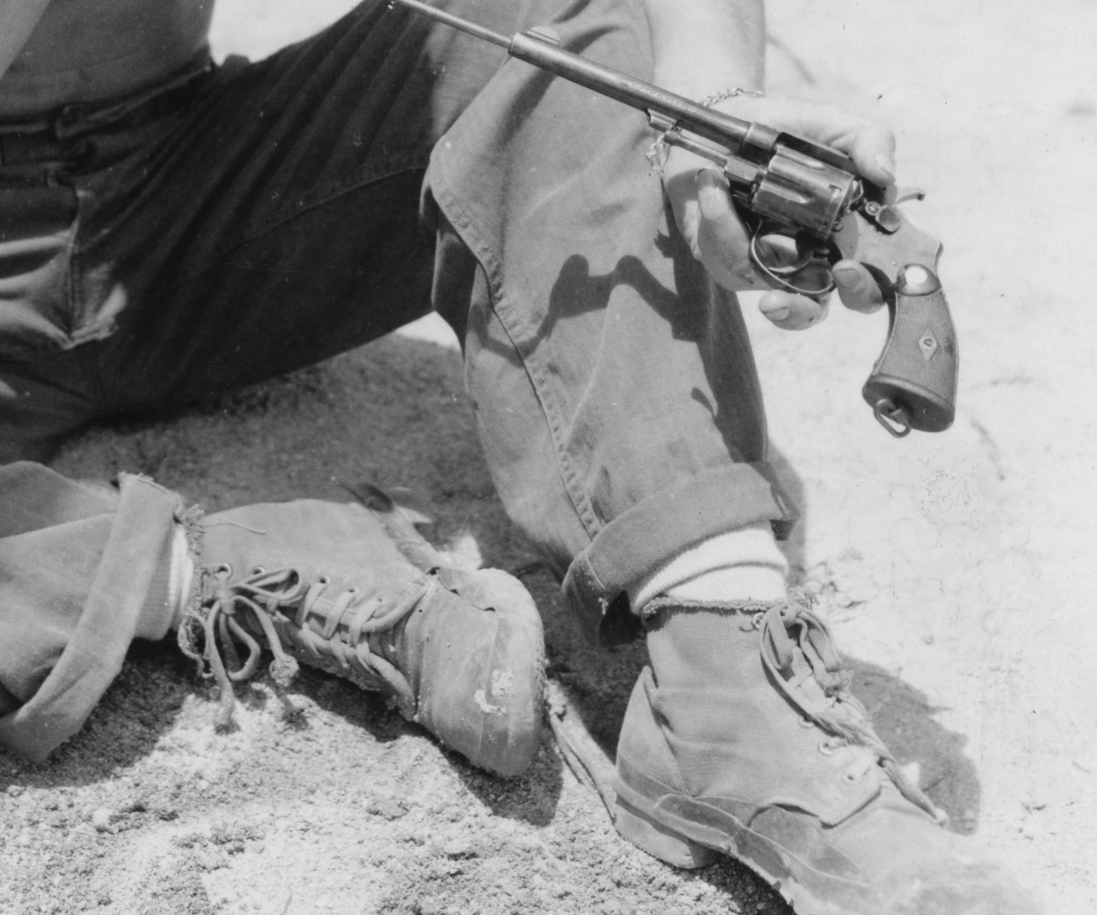 U.S. Army cavalry soldier cleaning a Smith and Wesson Military and Police type revolver on Los Negros Island in 1944
