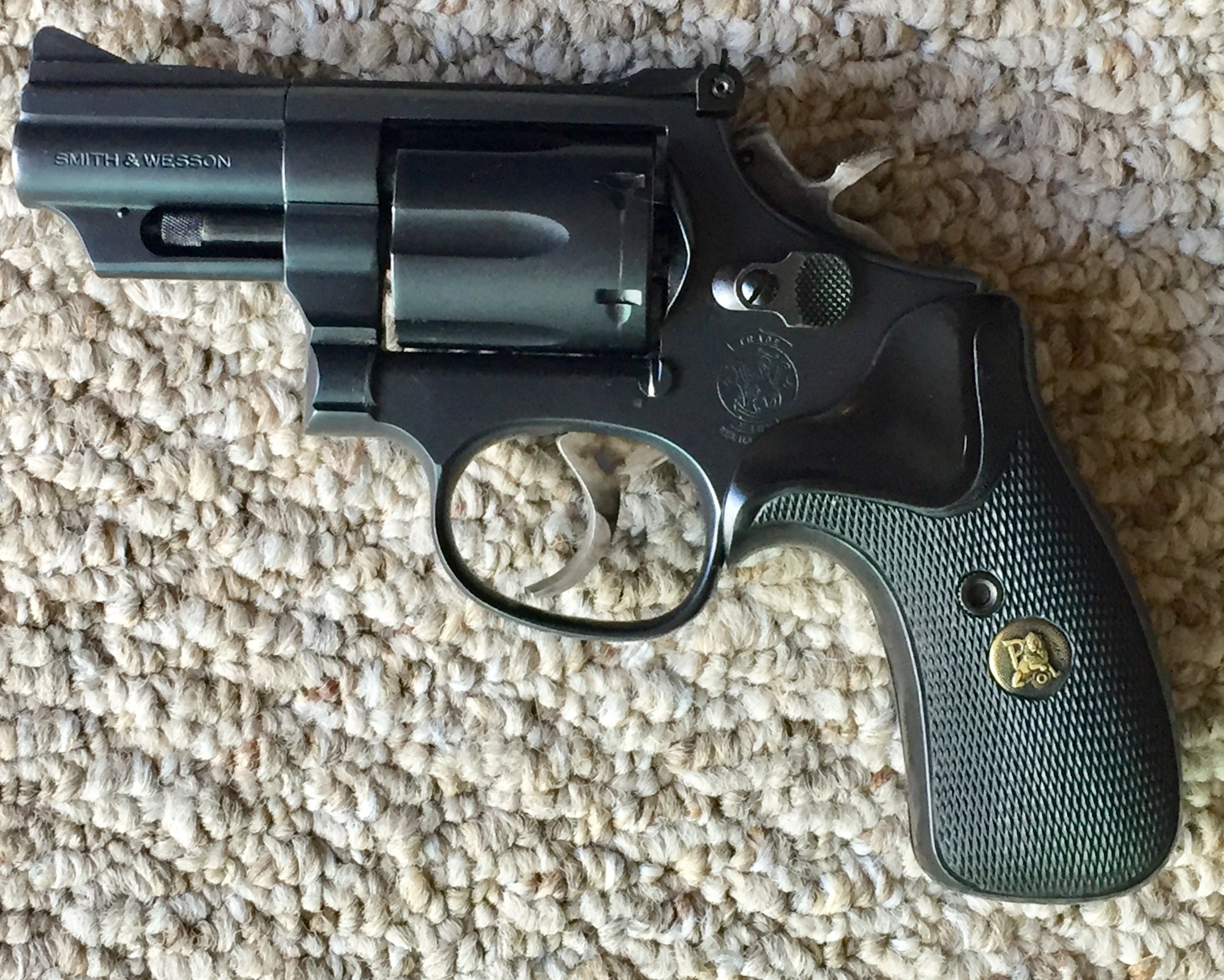 Smith and Wesson Model 19-5 revolver with 2.5-inch barrel, round butt and black finish, left side
