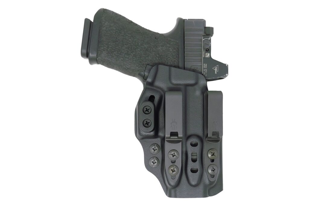 A Tenicor VELO5 appendix carry holster holding a Glock 19 with a red dot, rear view showing the clips and camming bar