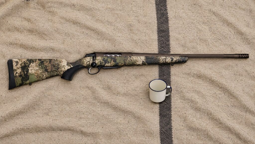 Tikka T3x Lite Veil Wideland with camo stock, bronze Cerakote barreled action and muzzle brake lying flat on a wool blanket