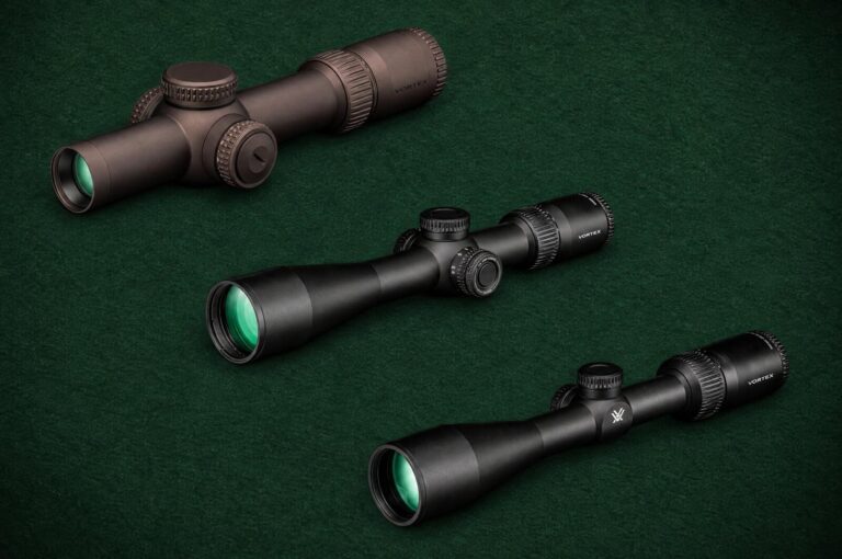 Vortex scopes from three tiers: a Razor HD Gen III 1-10x24, a Viper HD 3-15x44 and a Crossfire HD 3-9x40 lying on green felt