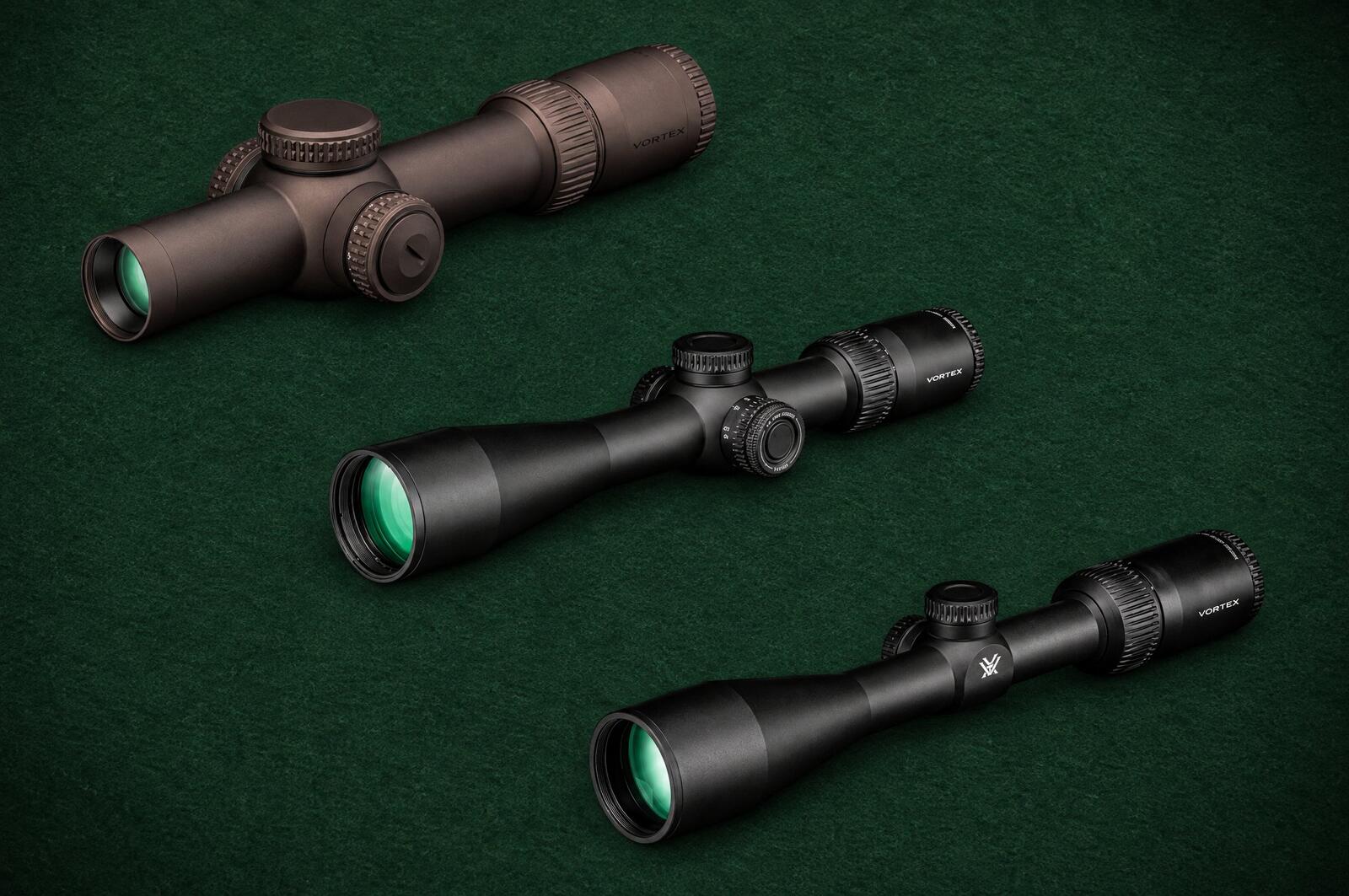 Vortex scopes from three tiers: a Razor HD Gen III 1-10x24, a Viper HD 3-15x44 and a Crossfire HD 3-9x40 lying on green felt