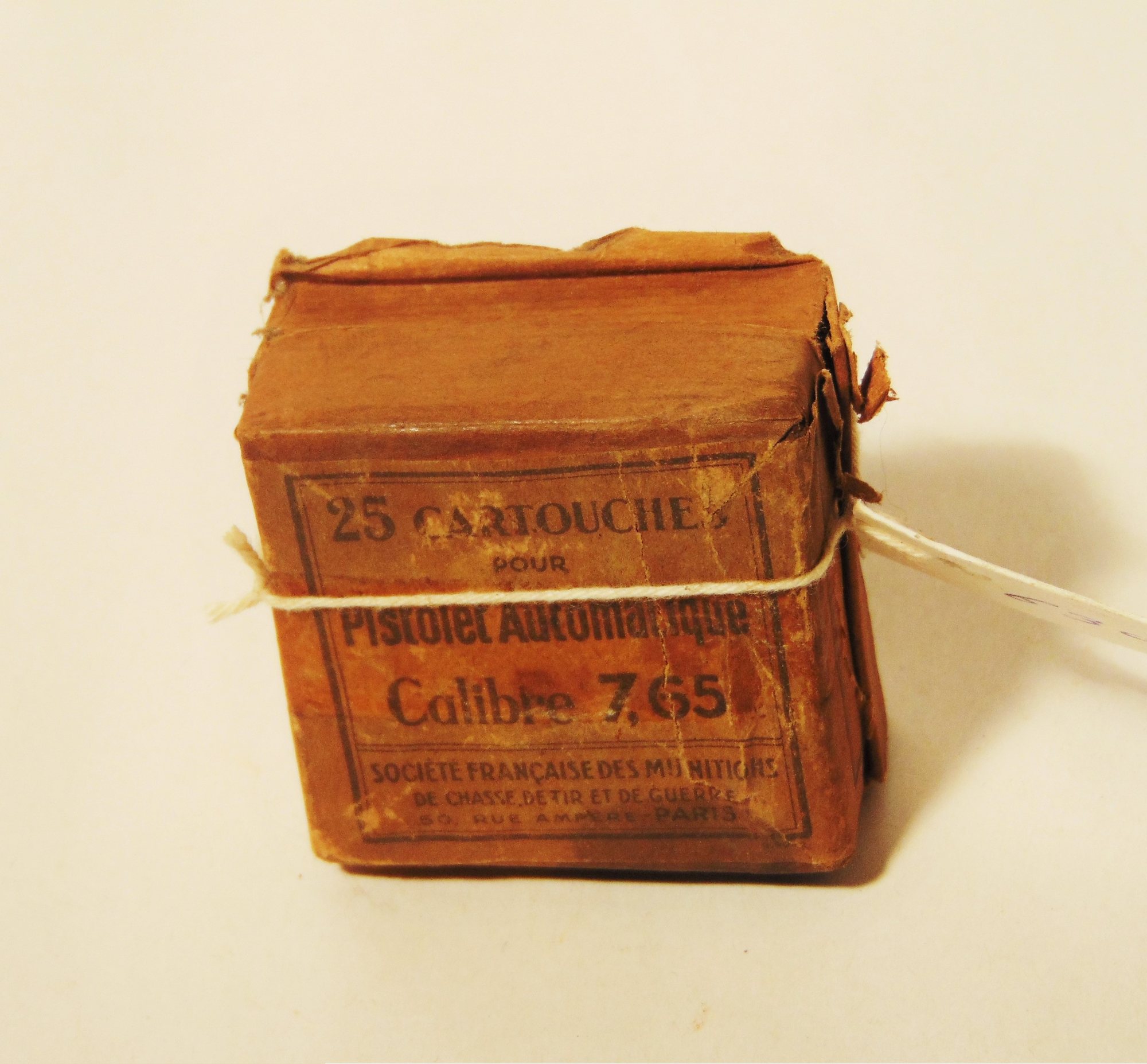 Wartime French-American paper packet of 25 pistol cartridges marked 7.65 tied with string
