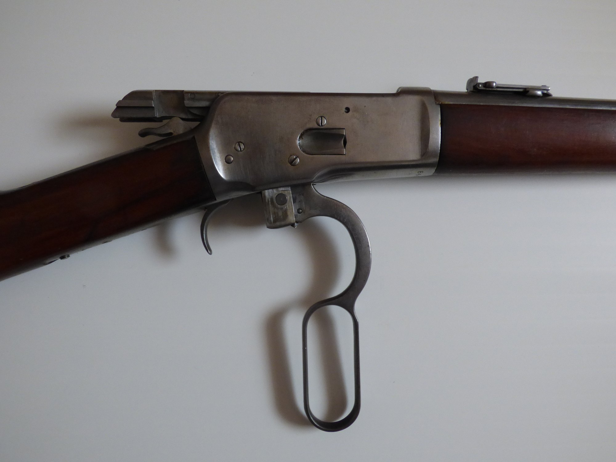 Winchester Model 1892 lever-action rifle with the lever down and the action open