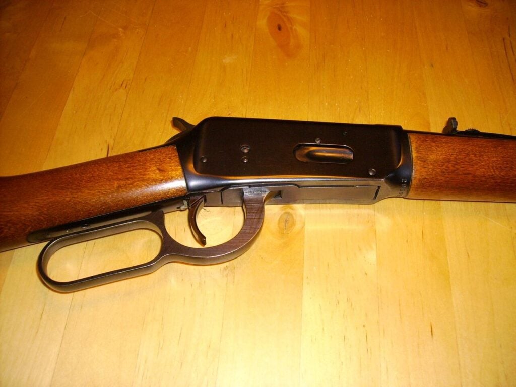 Underside of a late 1960s Winchester Model 94 carbine showing the serial number stamped at the bottom front of the receiver